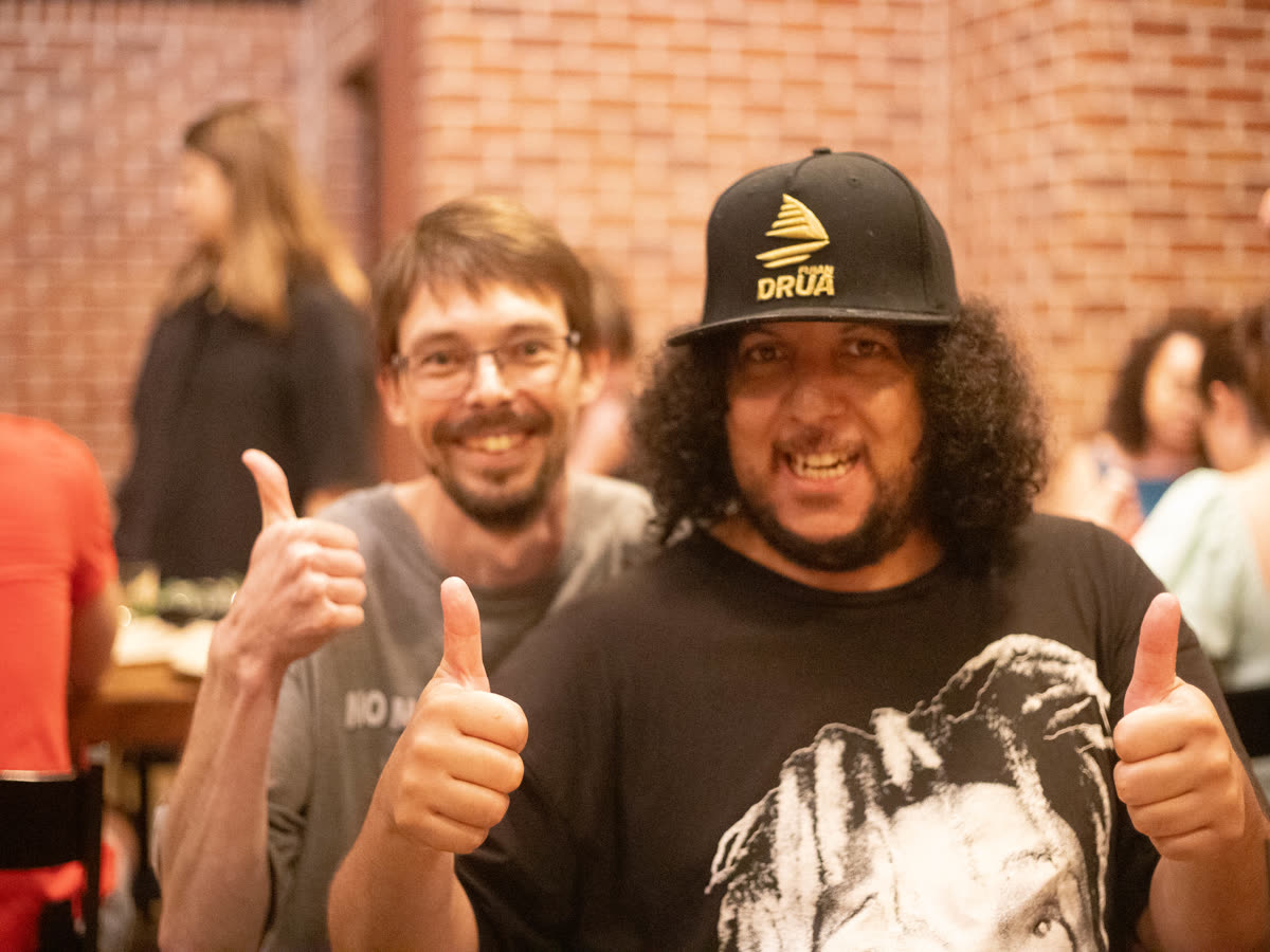 Two mates giving thumbs up at the Christmas dinner