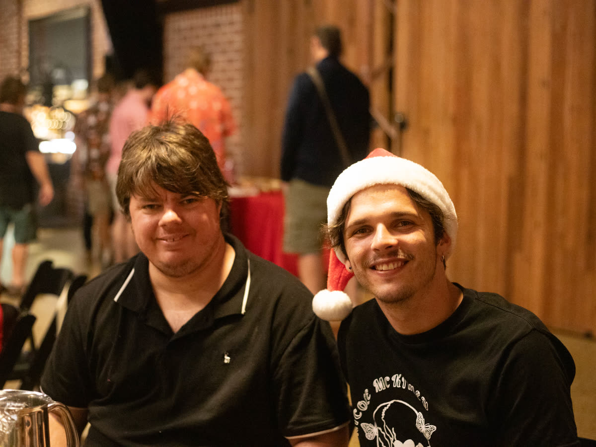 Two mates in festive spirit at the dinner table